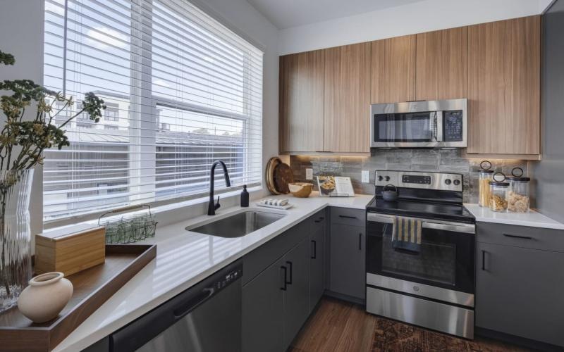 a kitchen with wooden cabinets