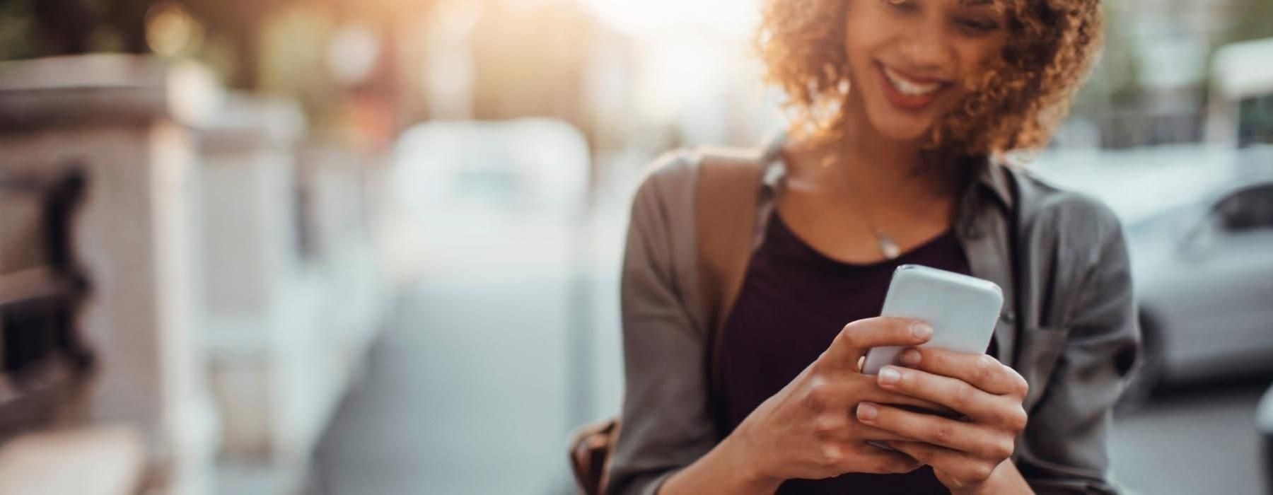 a woman holding a phone